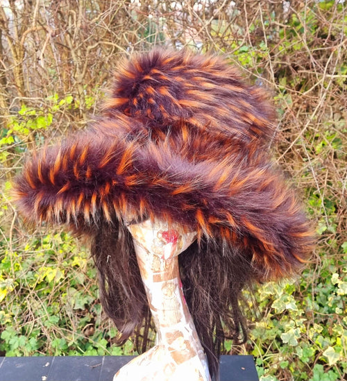 wide brimmed ladies winter hat in browns and orange. Luxury faux fur fabric