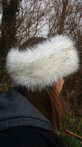 Husky faux fur headband in white with black tips, front view, fleece lined ear warmer handmade in England