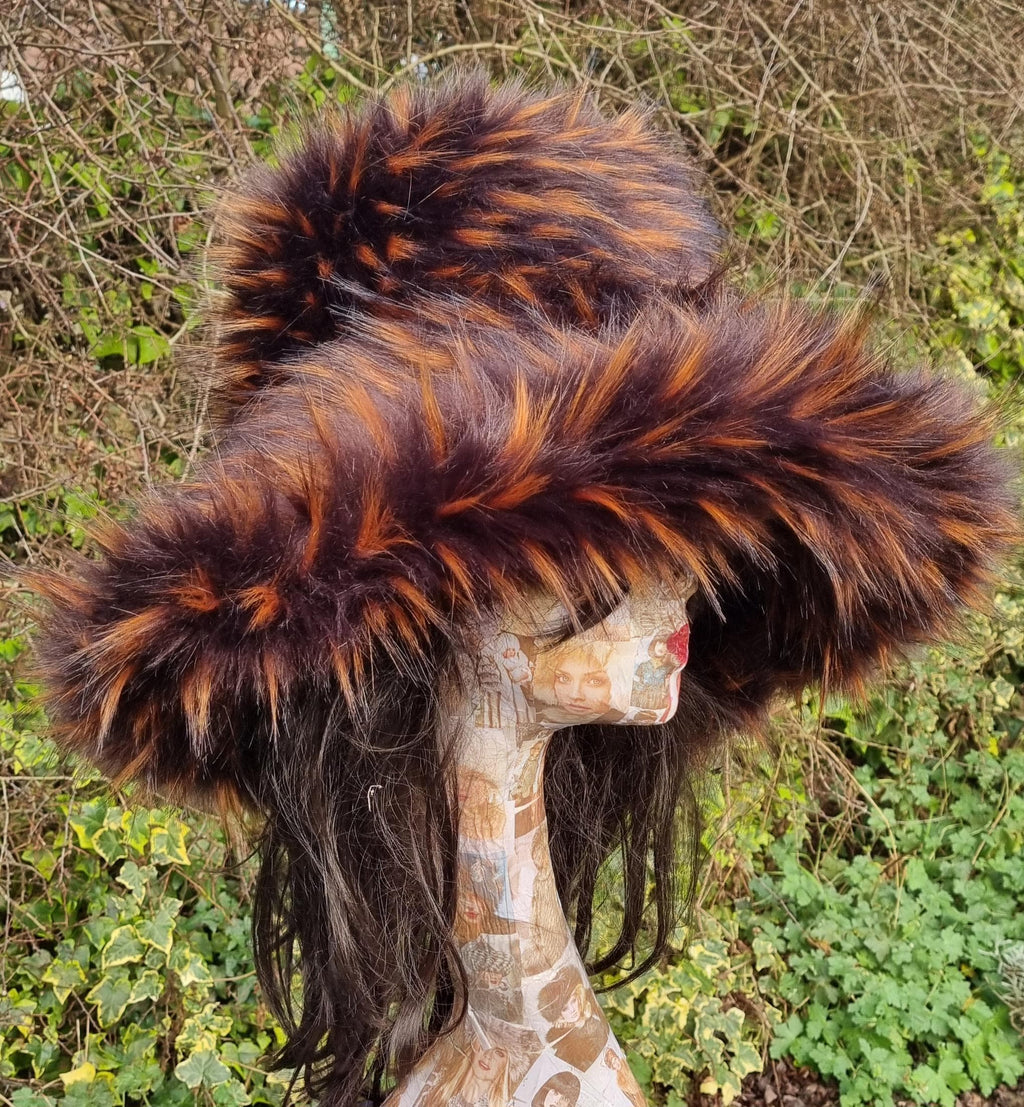 Luxury chocolate brown faux fur hat with orange tips detail, close-up of fur texture