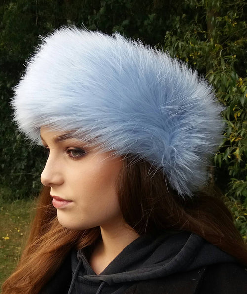 Luxury ice blue faux fur headband worn as ear warmer, side view, soft and cosy