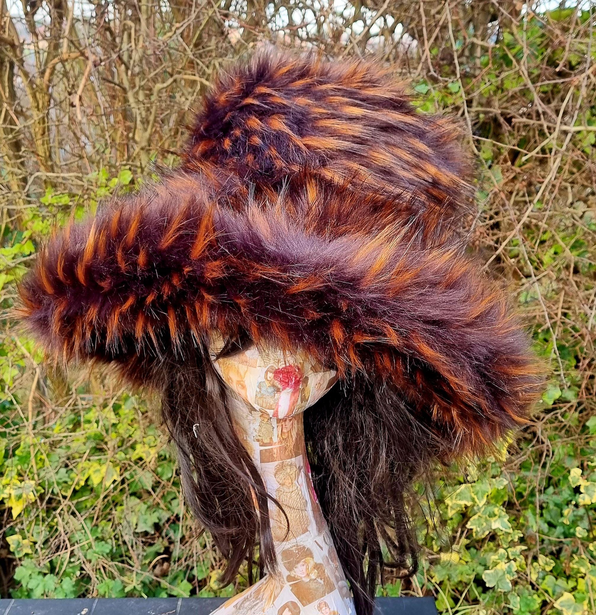 wide brimmed ladies winter hat in browns and orange. Luxury faux fur fabric