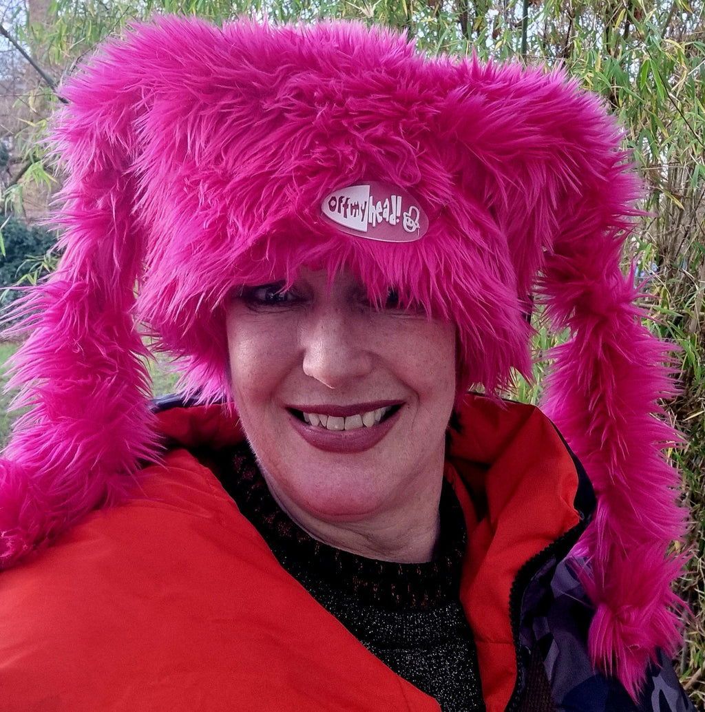 Oversized pink marshmallow hat ears tied up Russian style