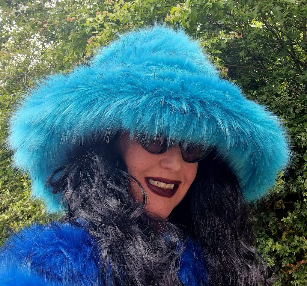 Oversized turquoise faux fur festival hat with structured wired brim, side profile