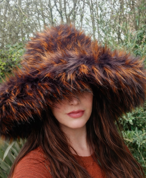 beautiful wide brimmed faux fur hat in winter colours of golds and browns