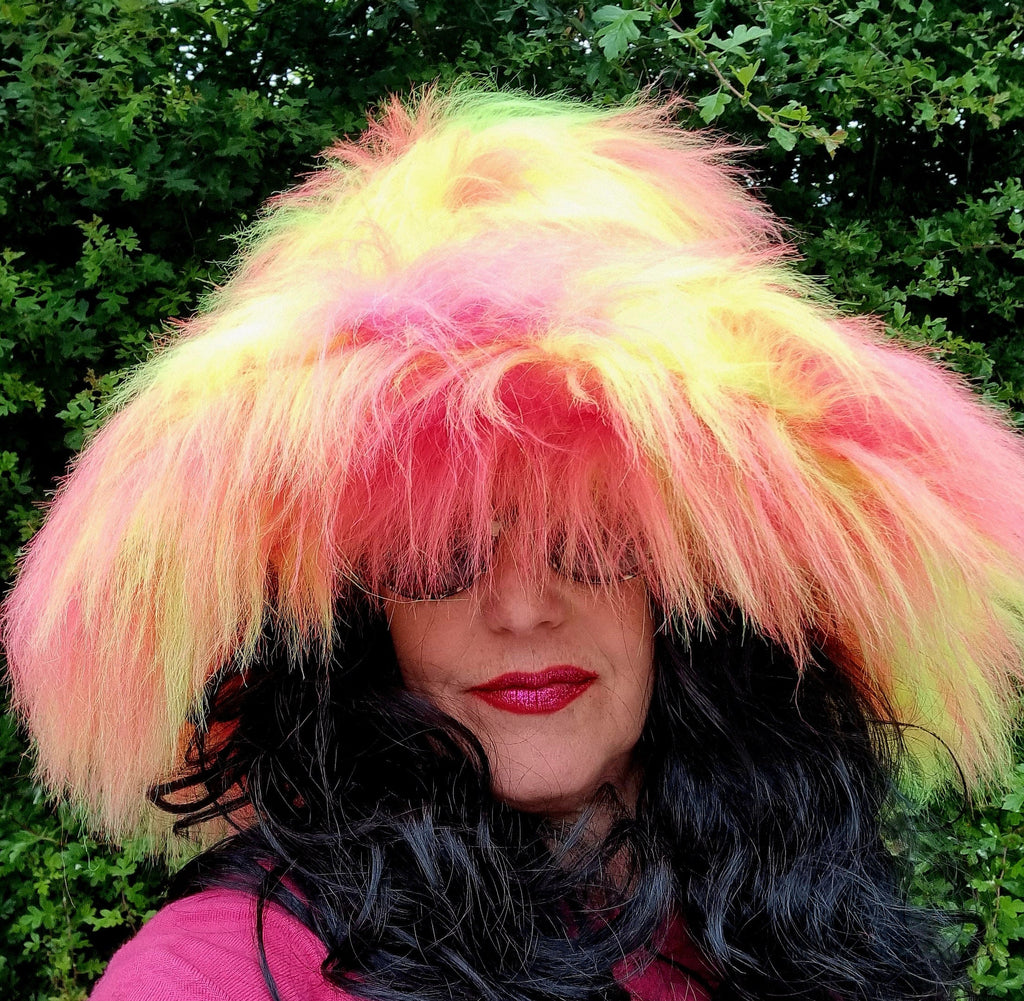 Wide brim pink and yellow fur hat side view showing 7-inch brim and long-pile faux fur fabric