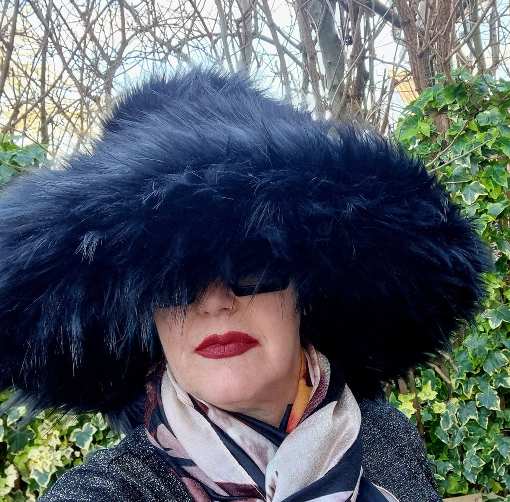 Voluminous black wide brim hat in luxury faux fur with wired edge, handmade statement hat for bold fashion looks