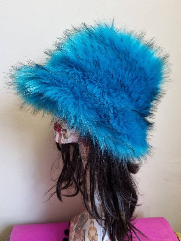Turquoise and black faux fur bucket hat — second side angle on mannequin, highlighting plush fur depth and hat shape