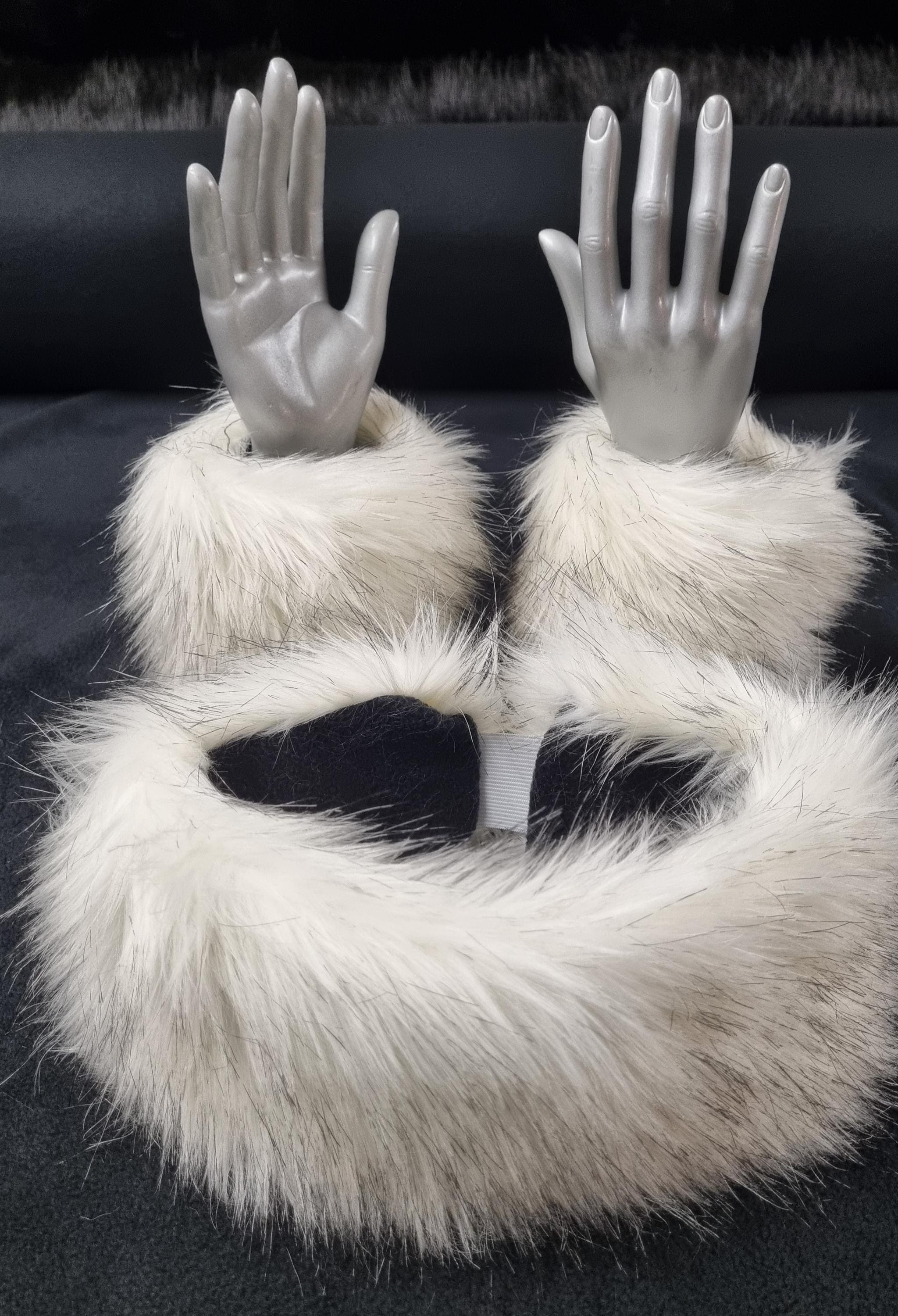 White fur cuffs with mannequin hands on a black background with matcking headband