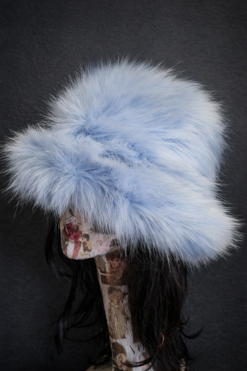 Baby blue fluffy faux fur bucket hat — side view on mannequin indoors, showing fluffy faux fur texture and floppy brim, handmade by Off My Head