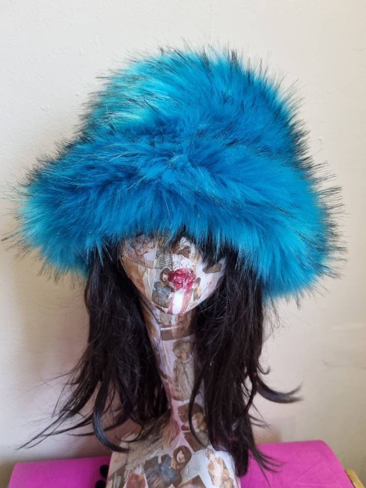 urquoise and black faux fur bucket hat — side view on mannequin indoors, showing long straight-pile faux fur texture and floppy brim, handmade by Off My Head