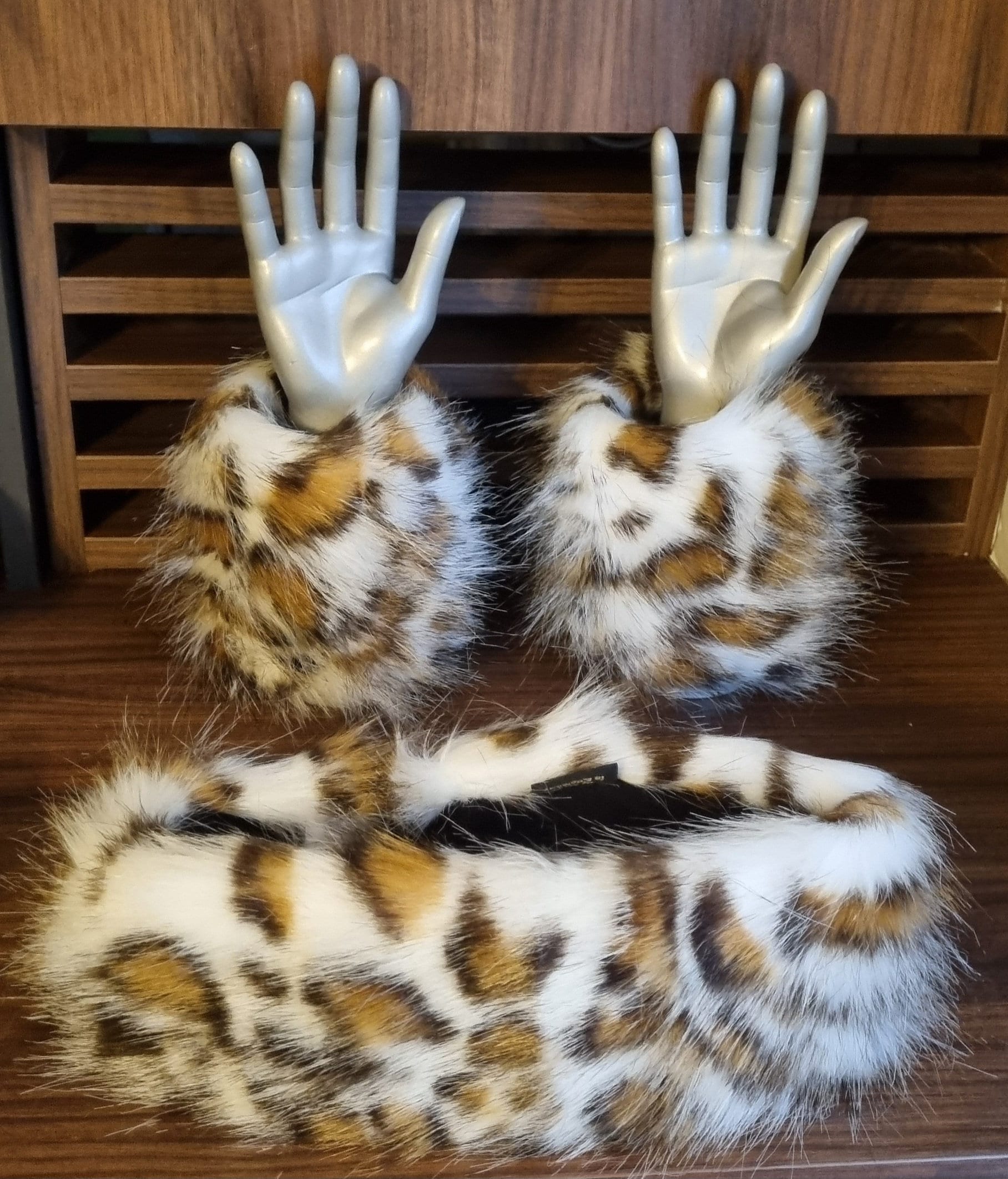 fluffy leopard print headband with a pair of matching cuffs