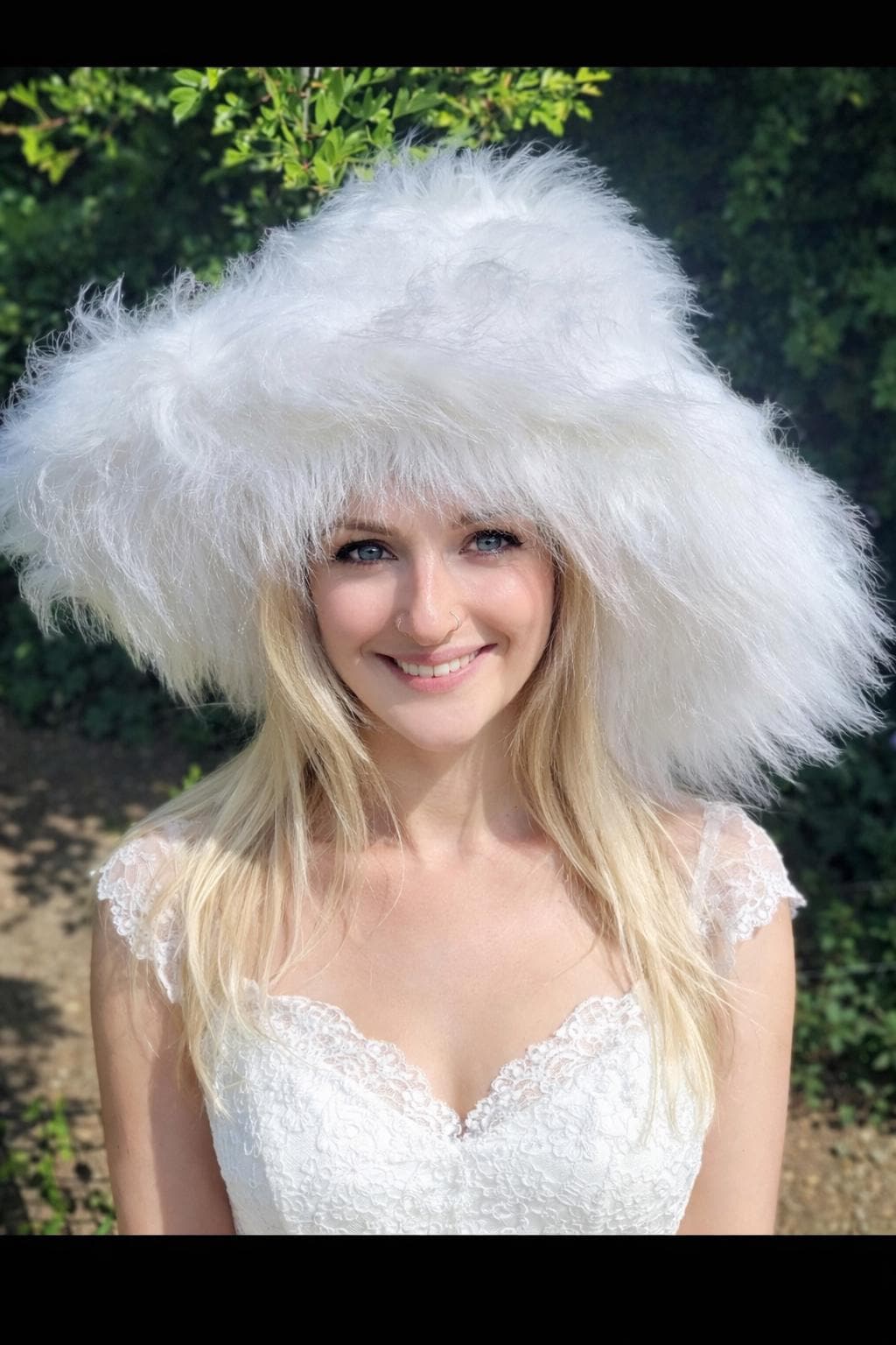 Oversized white faux fur bucket hat with extra-wide wire brim, handmade in England