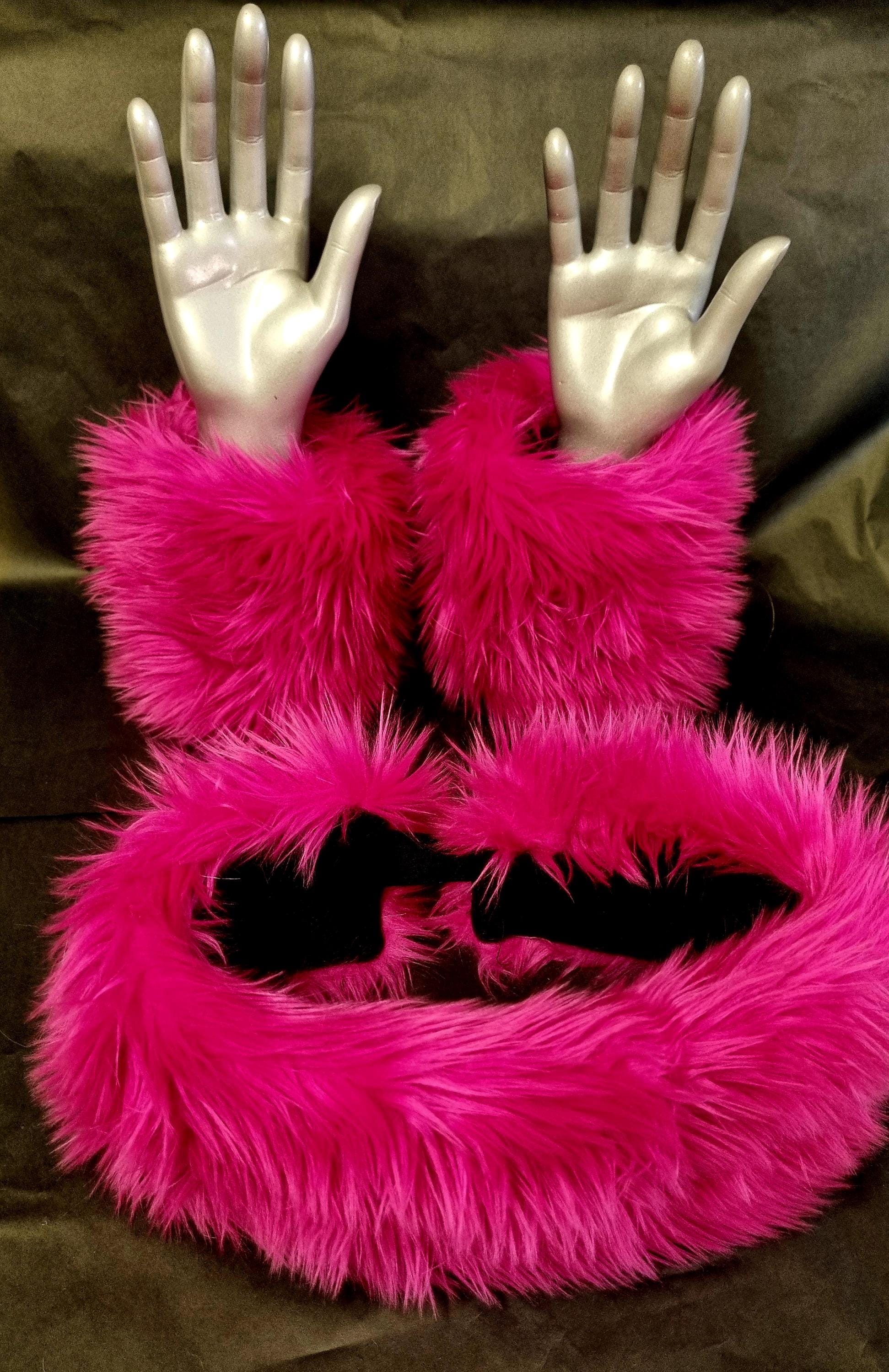 a set with matching headband and wrist cuffs in a shagg pink faux fur fabric