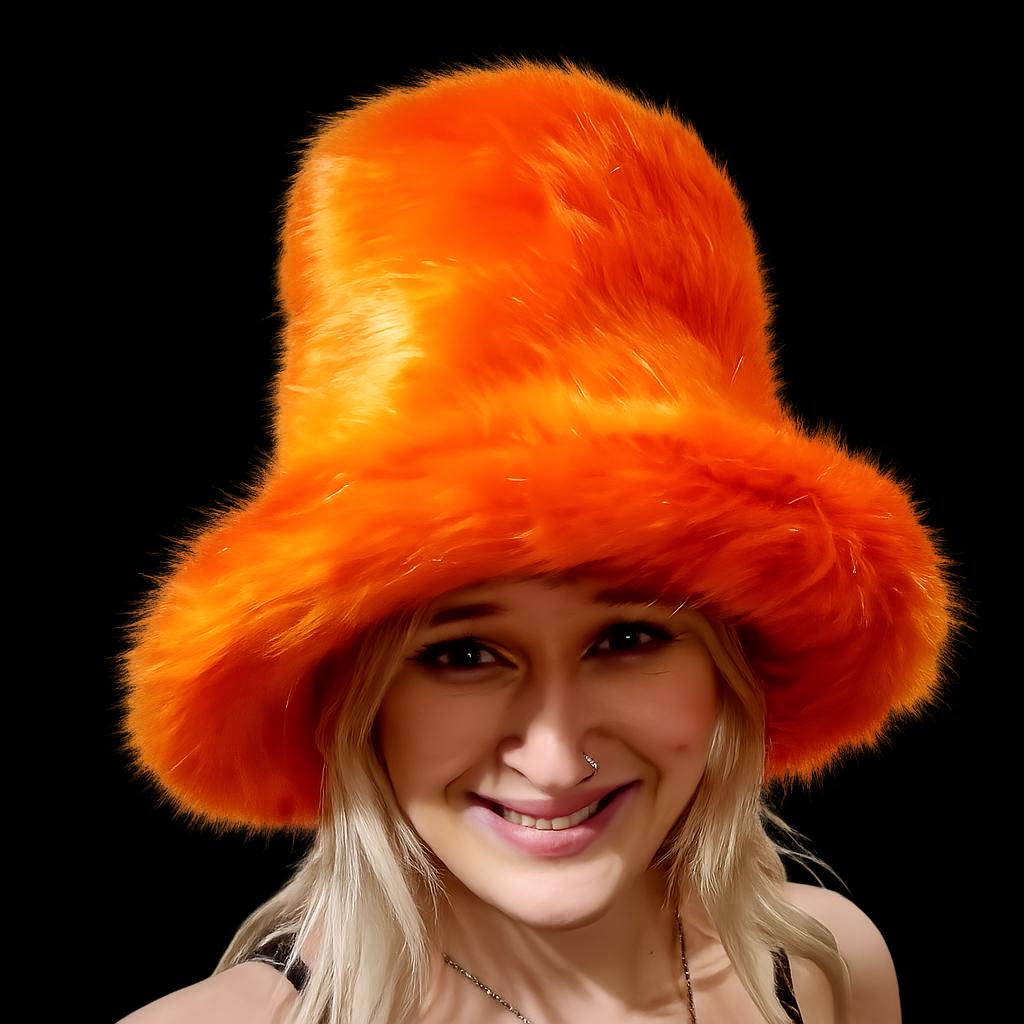 Tall orange fake fur hat with flat top styling, perfect for festivals and costume events
