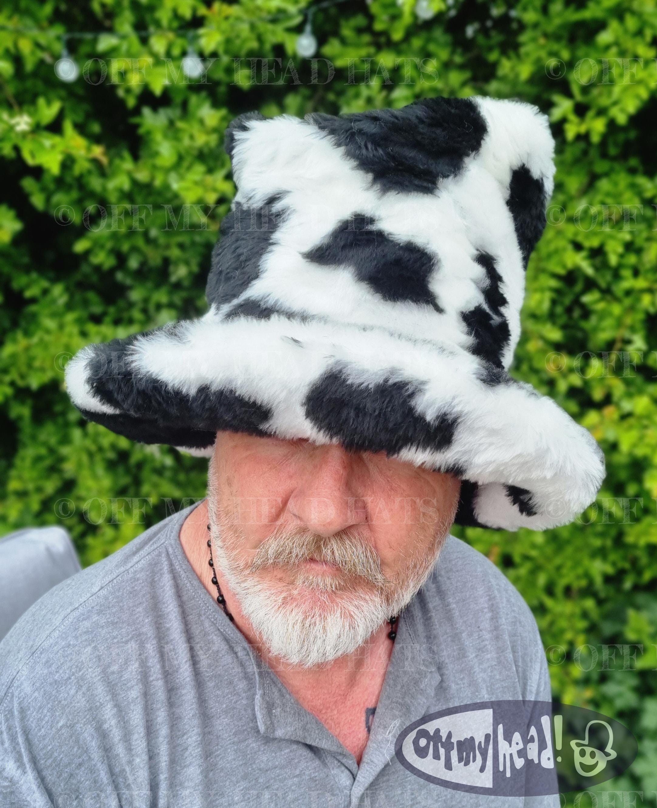 Black cow print tall hat with brim worn up - made to order