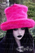 Person wearing a bright pink furry hat with 'Off My Head!' branding.