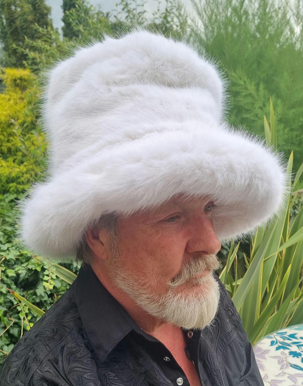 Side view of tall white faux fur stovepipe hat showing full height and brim detail
