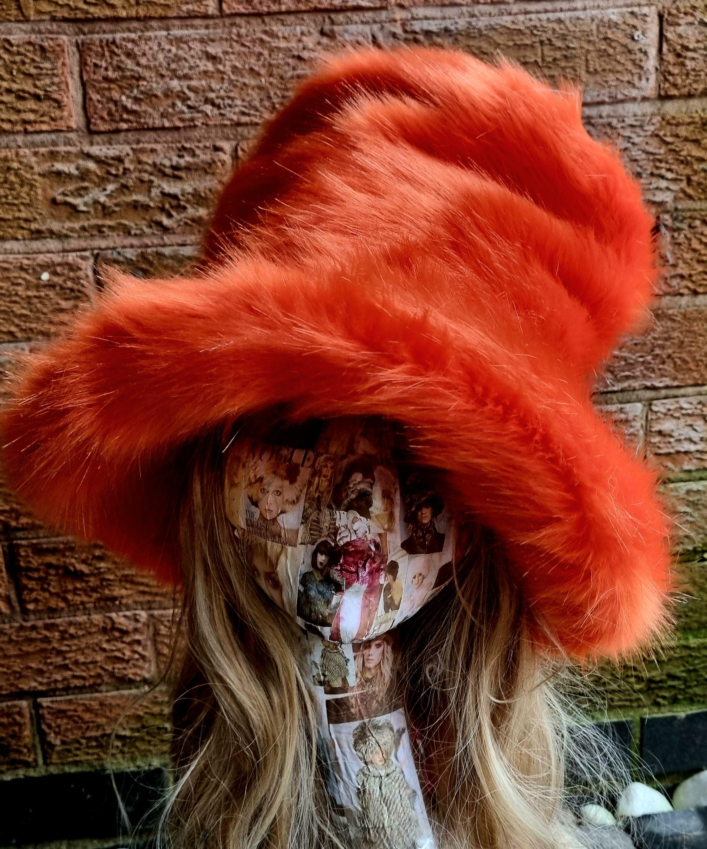 Front view of oversized orange faux fur hat showing sculptural tall crown
Orange faux fur hat styled flat on top, ideal for cosplay and street fashion