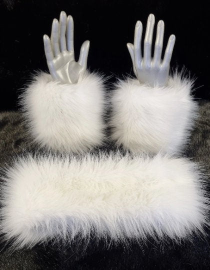 a pair of fluffty white faux fur cuffs and a matching headband
