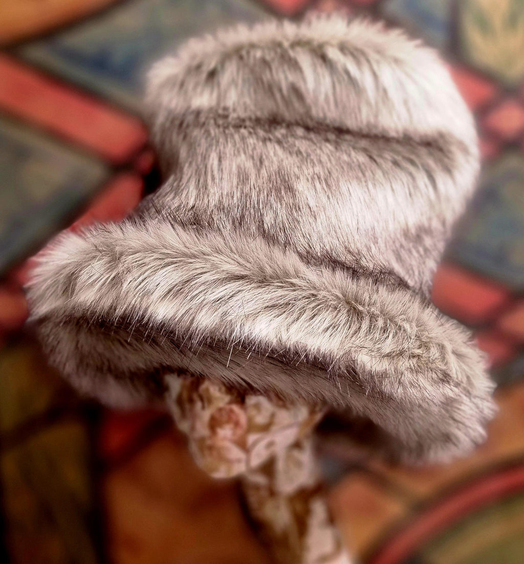 fluffy grey hat with a tall crown and wide brim in a siver grey fur fabric